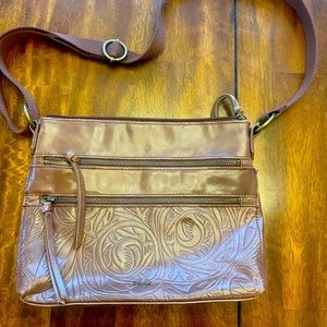 The Sak Teak Leaf Embossed Reseda Leather small crossbody